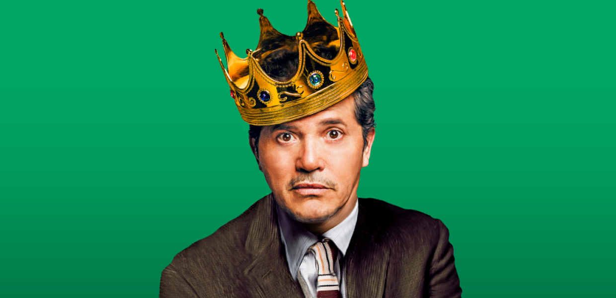 Photo of John Leguizamo wearing a crown