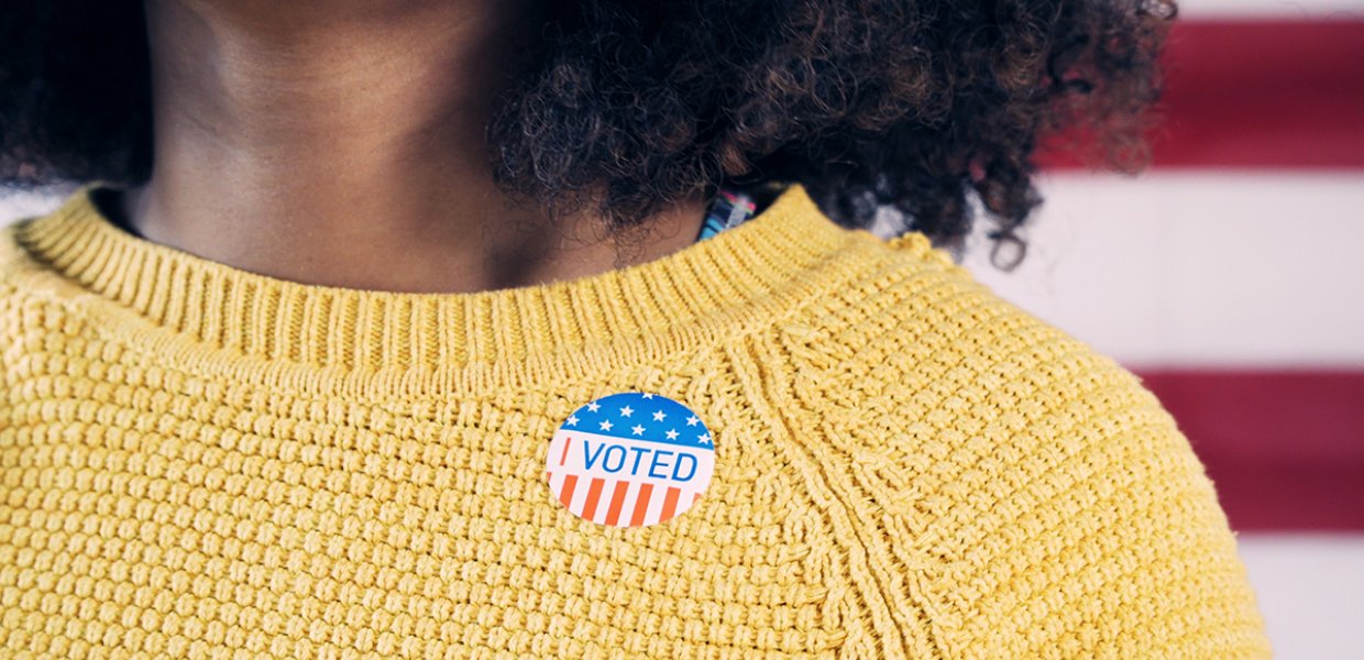 Photo of a person with an "I voted" sticker