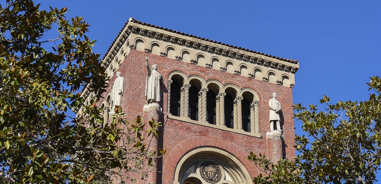 Statues on the roof of Bovard. 
