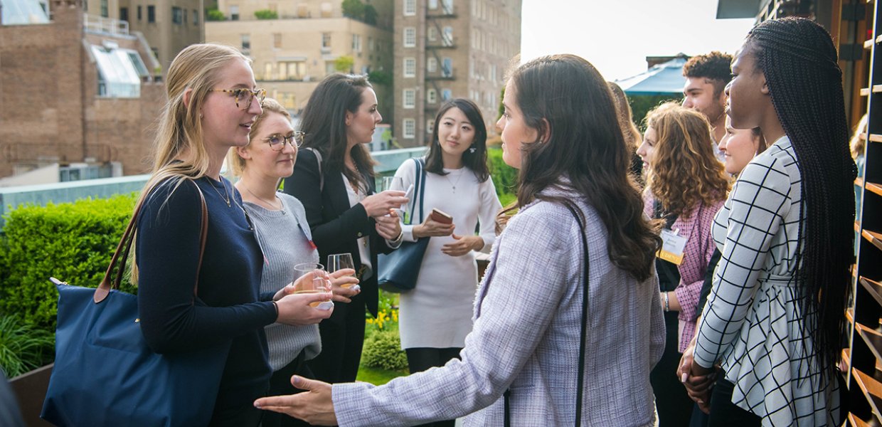 Photo of students speaking with eachother