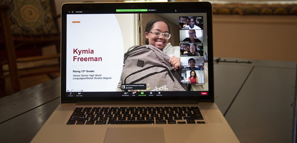 Photo of a laptop with Kymina Freeman on the screen