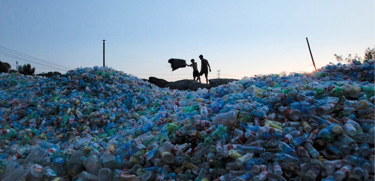 Photo of people standing on a landfill