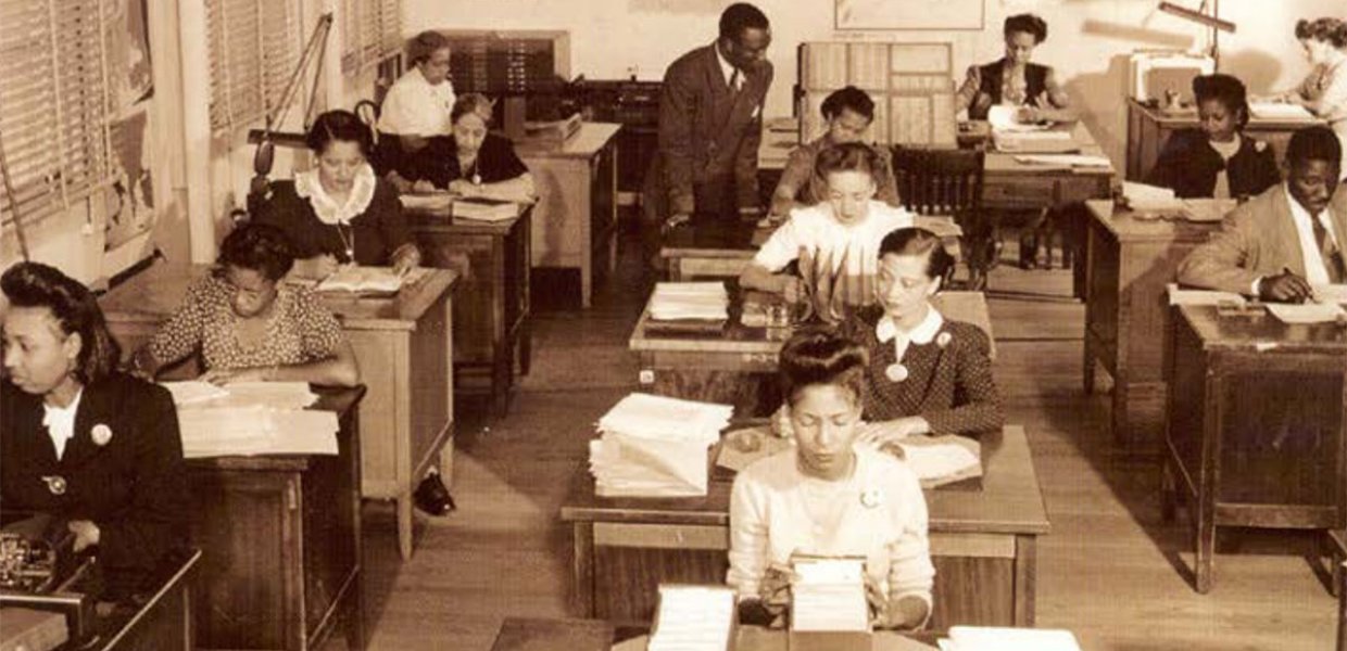 Photo of people sitting at desks