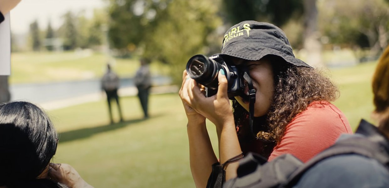 Photo of a person holding a camera