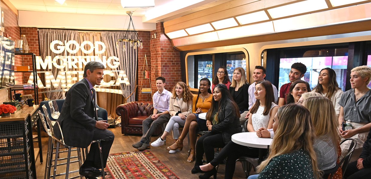 Photo of a group of people speaking to a speaker at a Good Morning America event