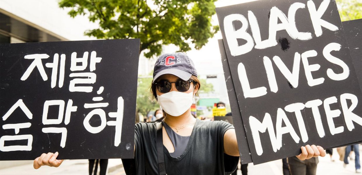 Individual holding Black Lives Matter sign