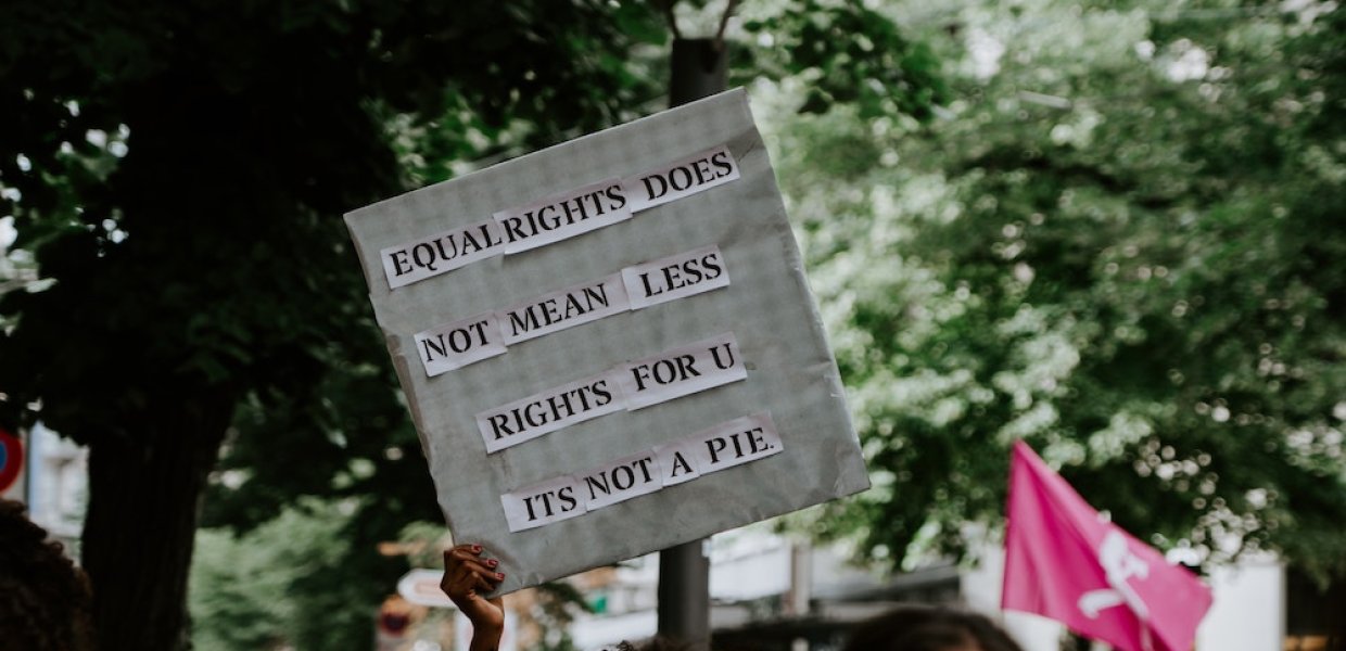 Photo of a sign that says "equal rights does not mean less rights for u its not a pie"