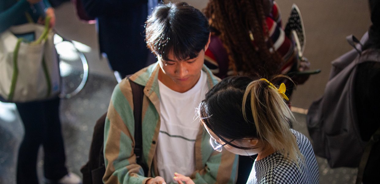 Two people talking at the 2023 career fair.