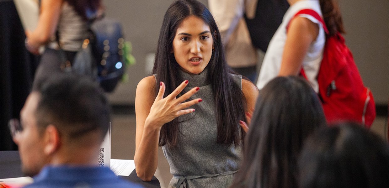 New Annenberg students socialize before the new student assembly in the ANN Forum, 2024.