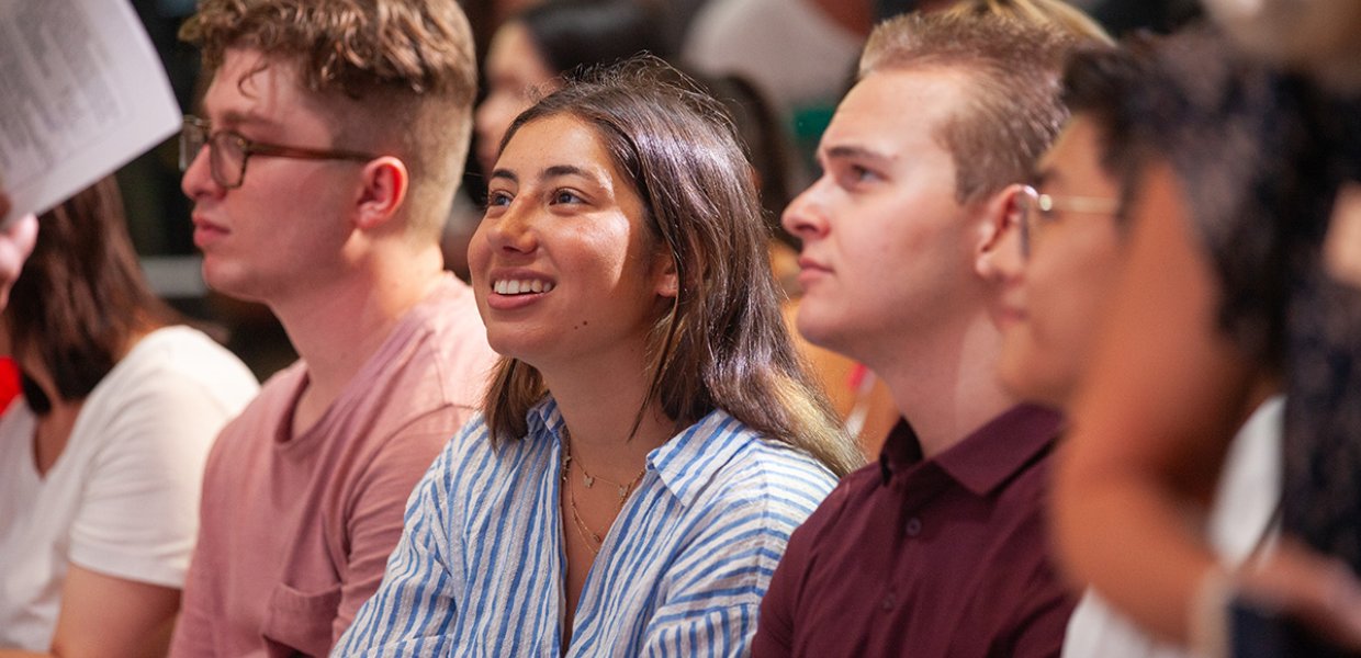 Saphia Zaman sitting at the new student assembly, 2023.