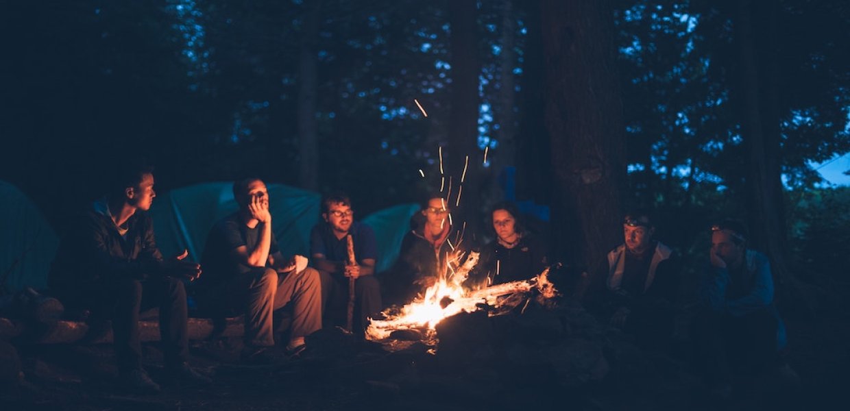 Photo of people around a campfire