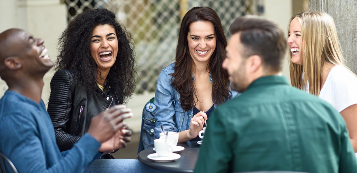 A diverse group of people laughing