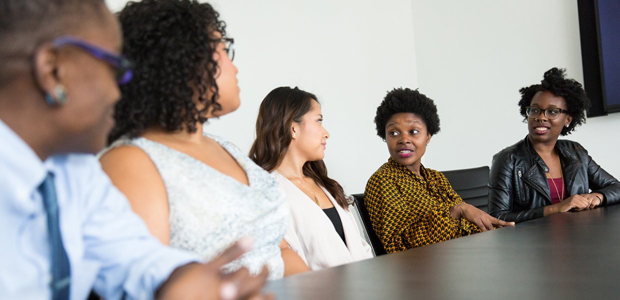 Photo of people talking in a meeting room