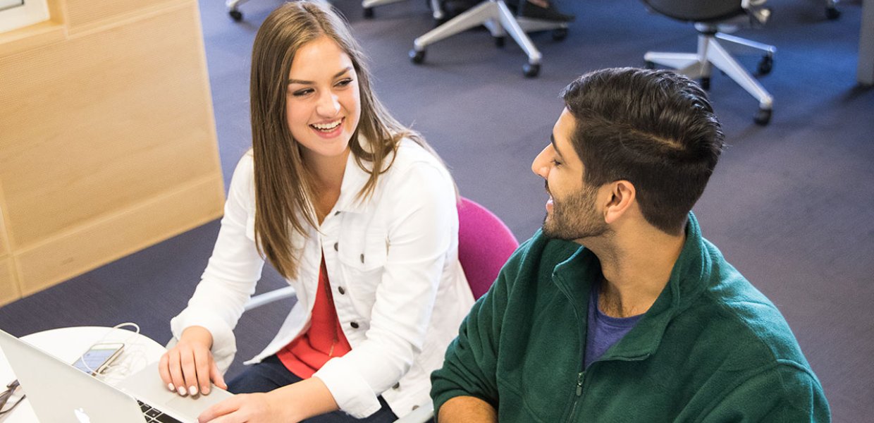 Photo of two students talking