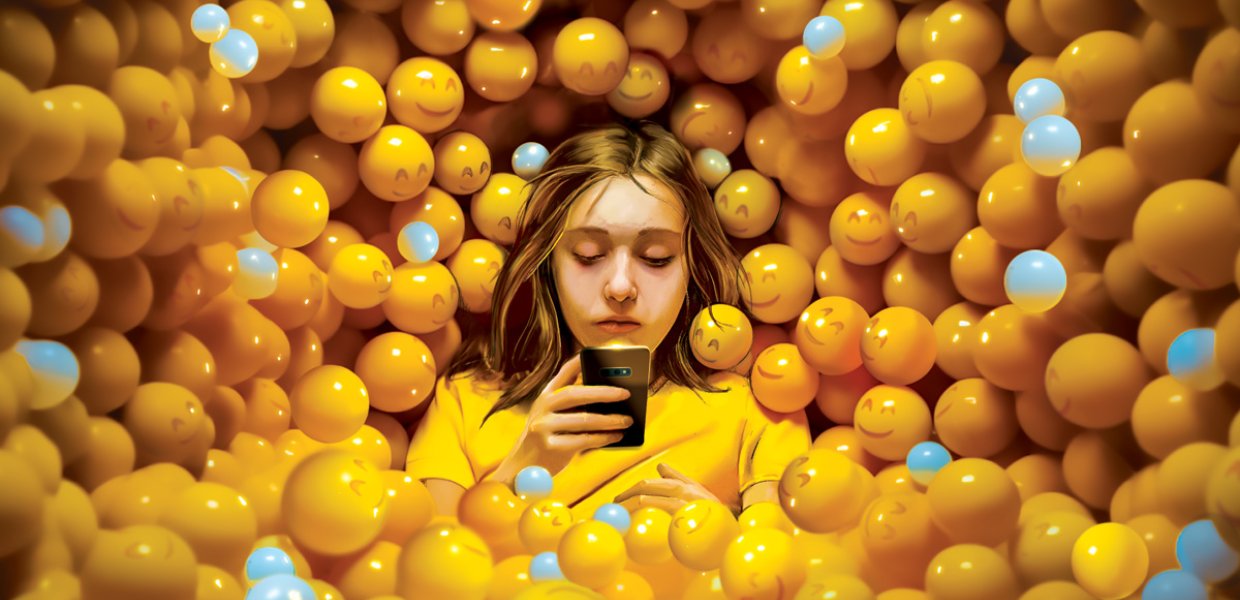 A young woman immersed in her phone, surrounded by yellow smiley face balls