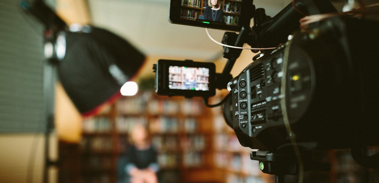 A camera recording an interview.