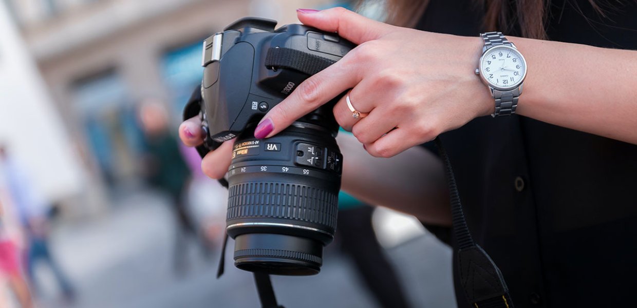 Photo of a person holding a camera