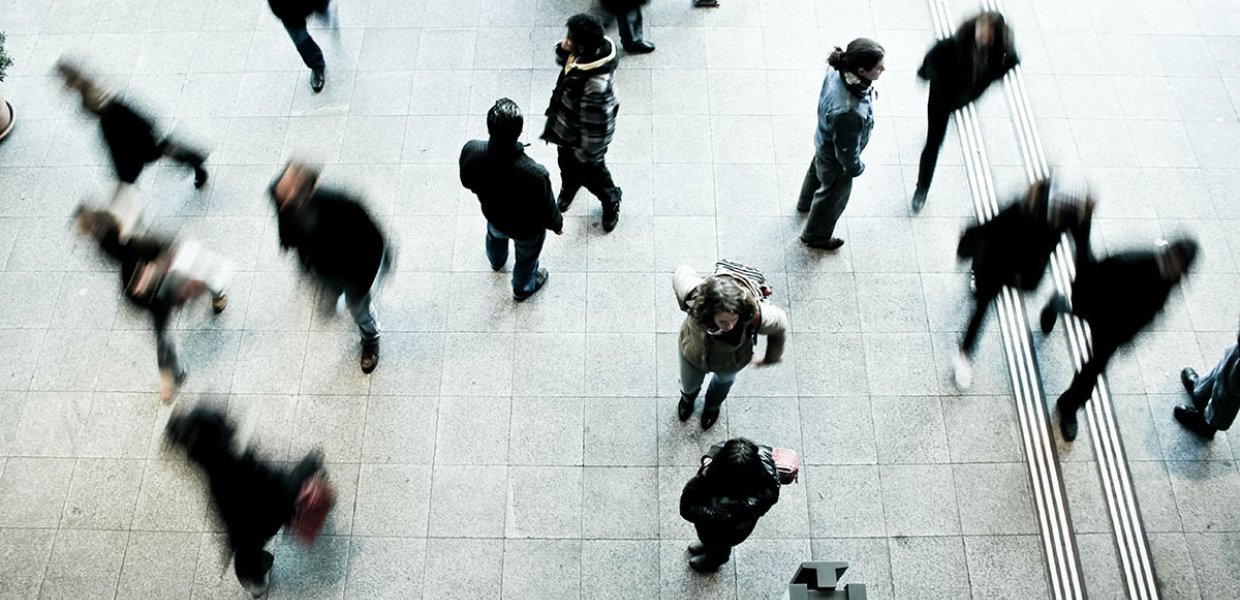 Photo of a people in a crow walking