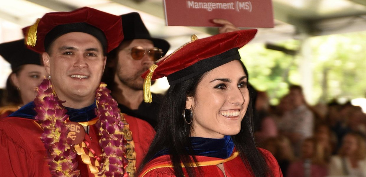 Alexandria Arrieta and Eduardo González march at the front of USC Annenberg’s processional, 2024.