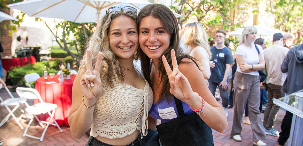 Margaux Dambacher with a friend at the 2023 move-in day reception.