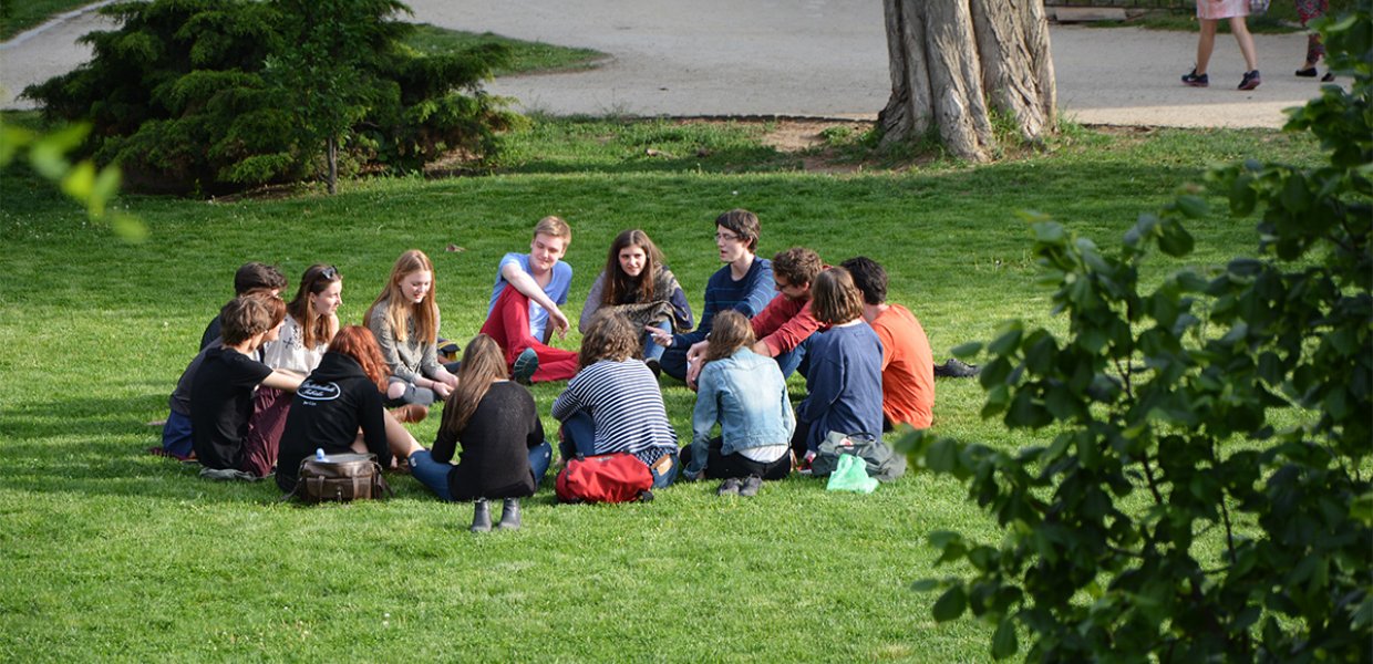 A group of people gathered in a circle.