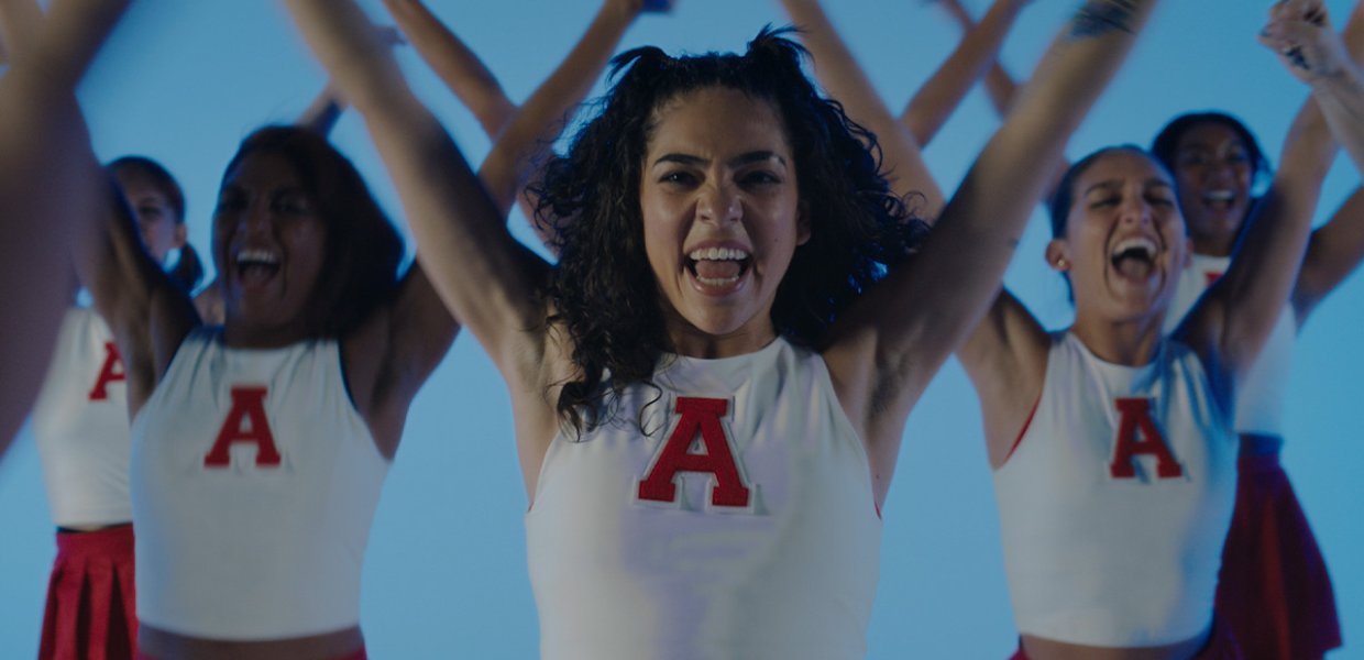 Cheerleaders wearing the letter A.