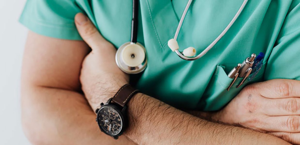 Photo of a medical professional with their arms crossed