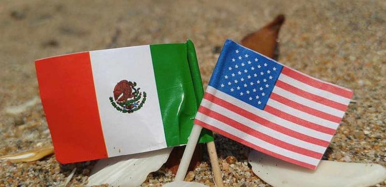 Photo of and American flag and a Mexican flag