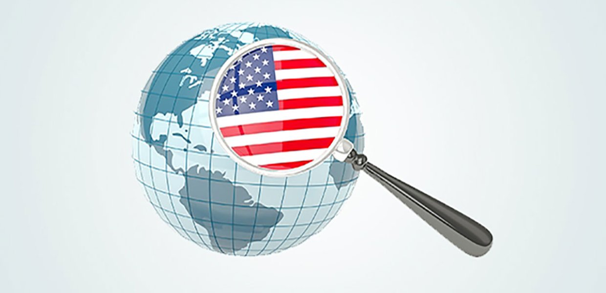 Illustration of a globe with a magnifying glass that holds another illustration of the American flag