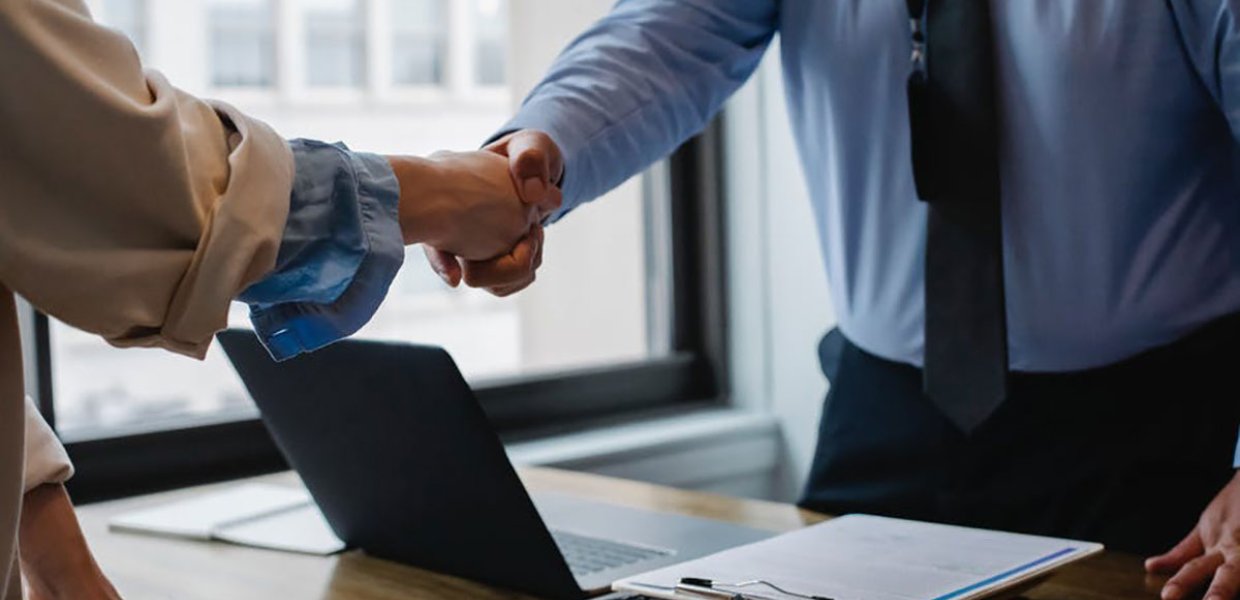 Photo of two people shaking hands