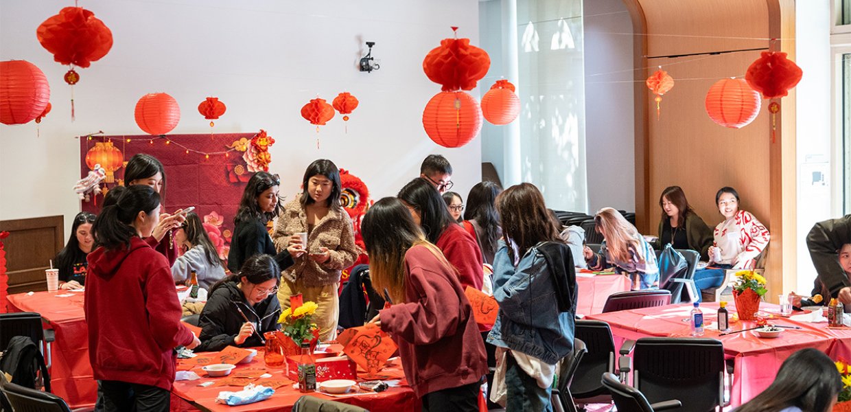 A group of students gathered around a table