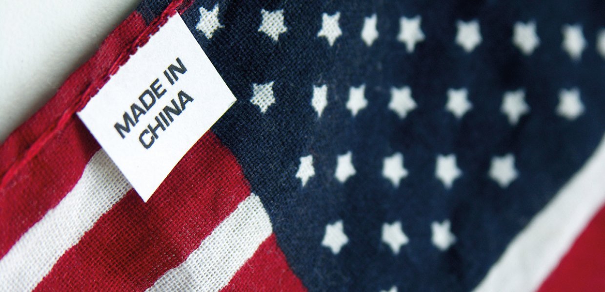 Image of a tag that reads "made in china" on an American flag