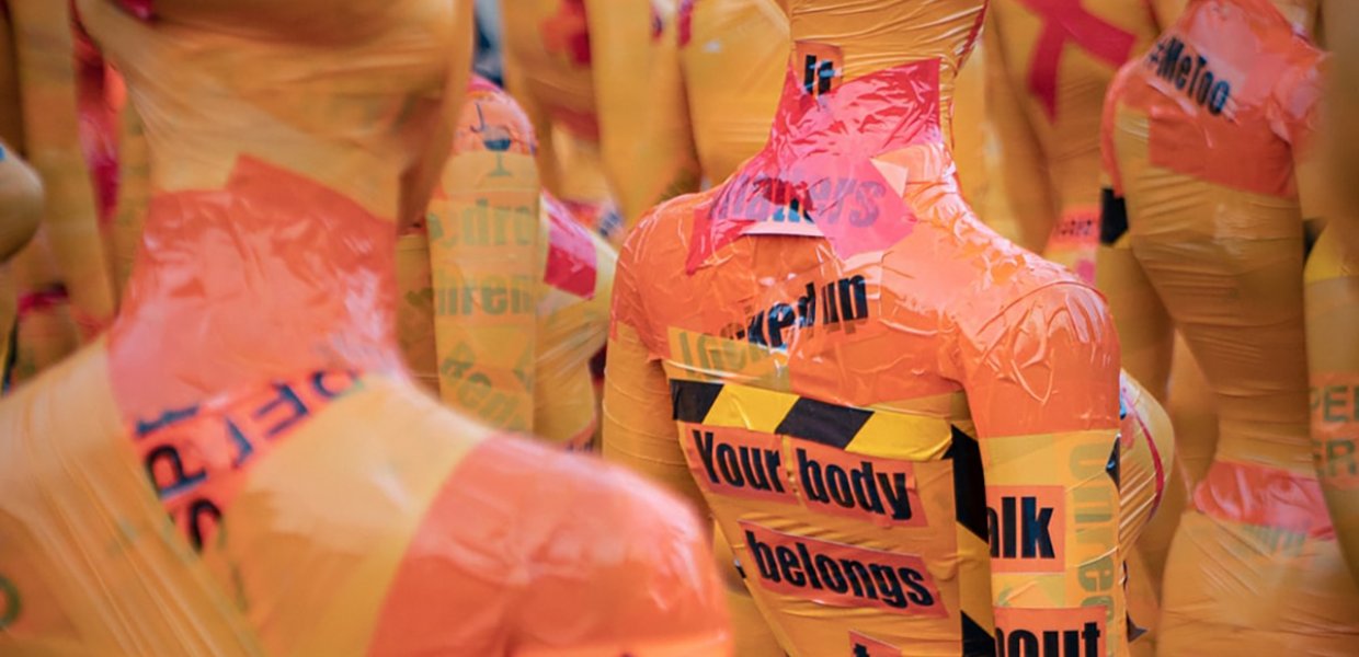 Image of mannequins wrapped in caution tape and other material. One reads "Your body belongs to you"