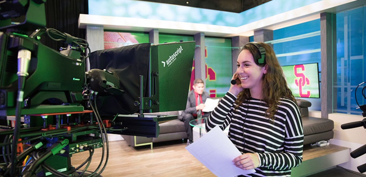 Photo of a USC Annenberg student in the media center studio