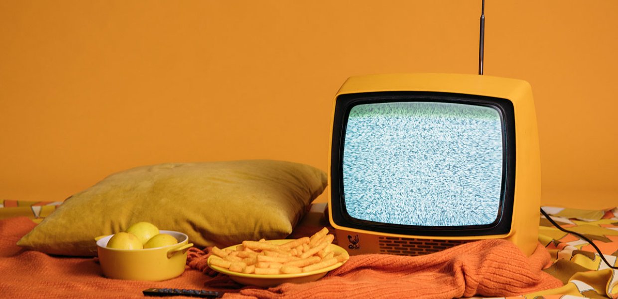 Photo of some snacks next to a television