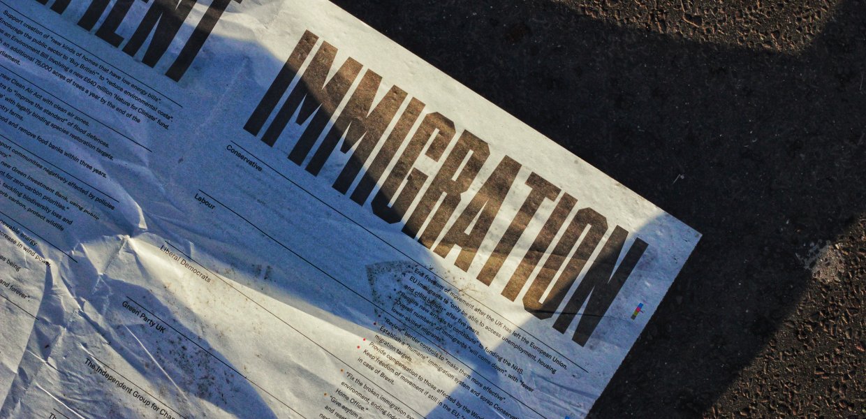 Photo of a paper that reads "Immigration" in big, bolded font