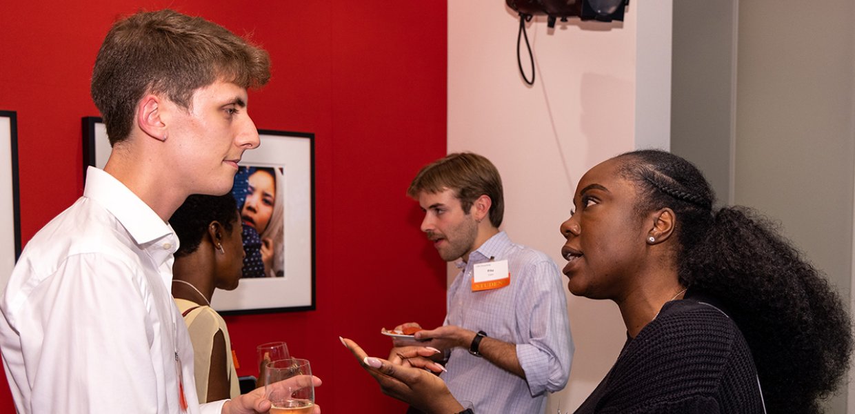 Four people engaged in discussion at a previous Annenberg networking event