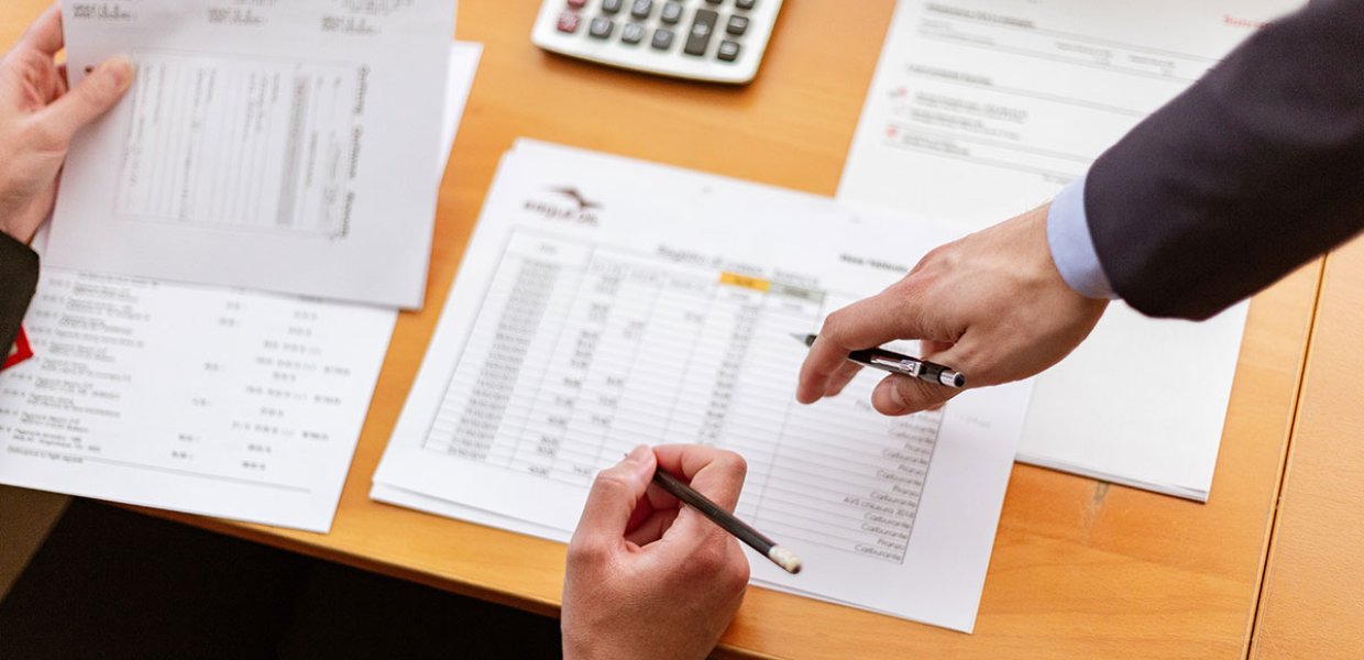 Photo of two people reviewing documents