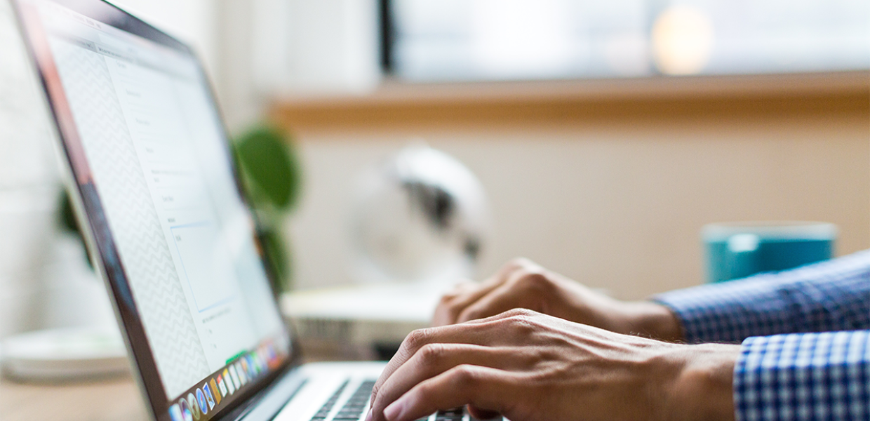 Photo of a person using a macbook