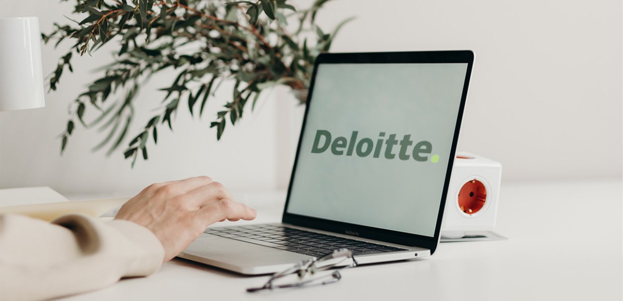 Photo of a laptop screen that says "Deloitte"