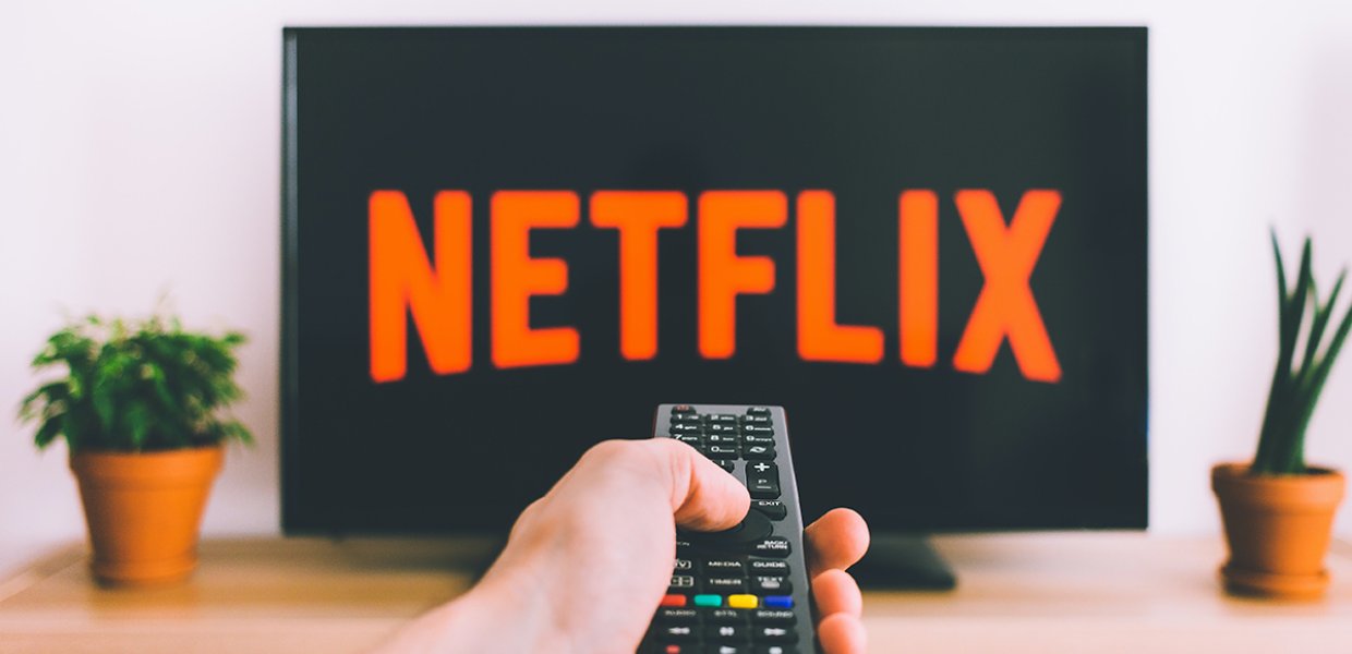 Photo of Netflix on a television and a remote control