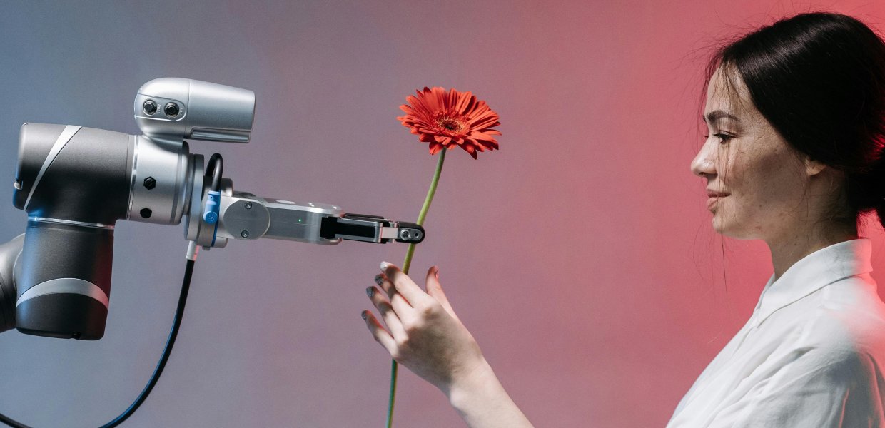 Robot and human sharing a flower