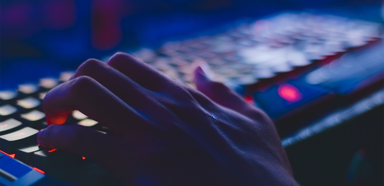 Photo of a hand on a keyboard