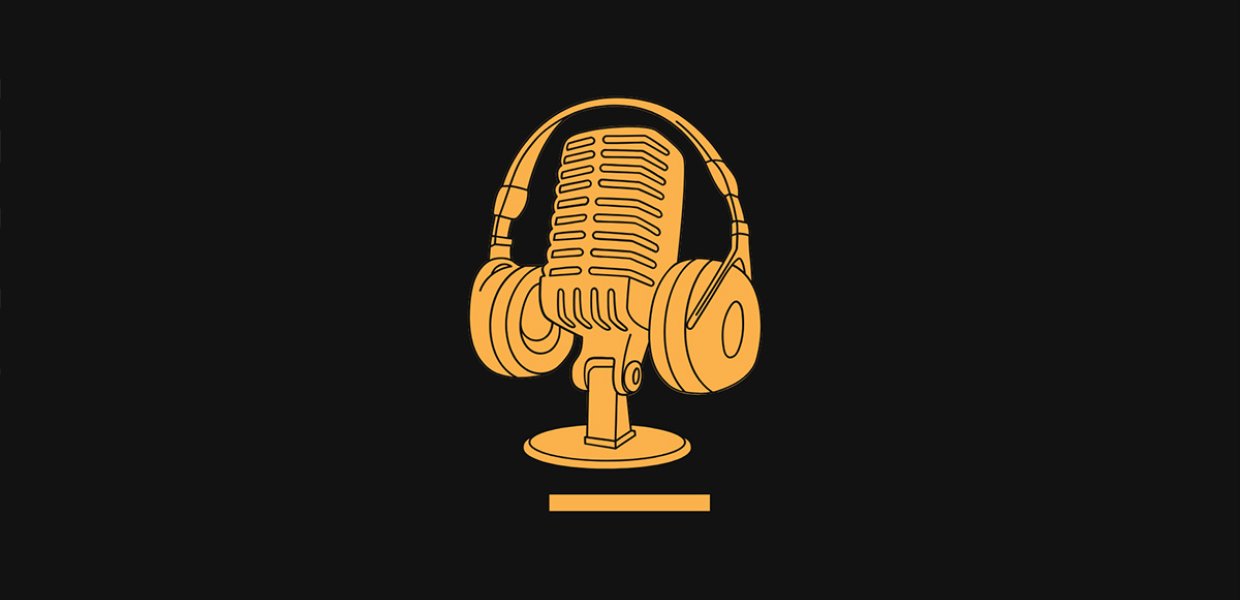A pair of headphones hanging on a microphone