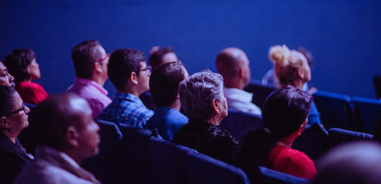 Photo of people sitting in rows