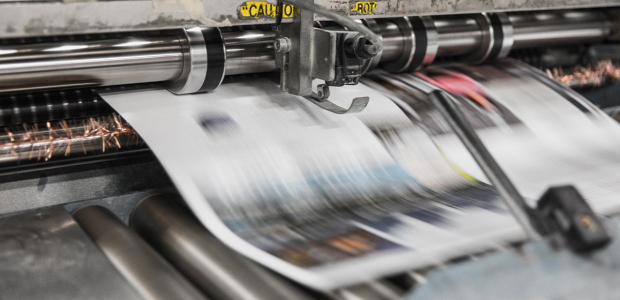 Newspaper being printed. 