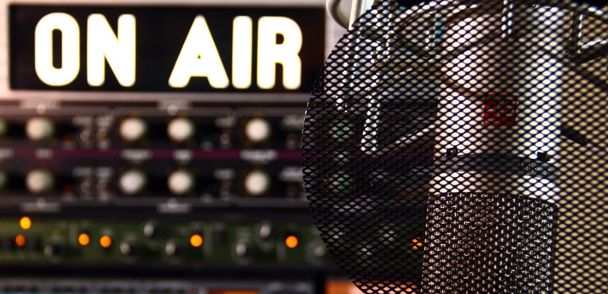 Image of a radio microphone and an "on air" sign