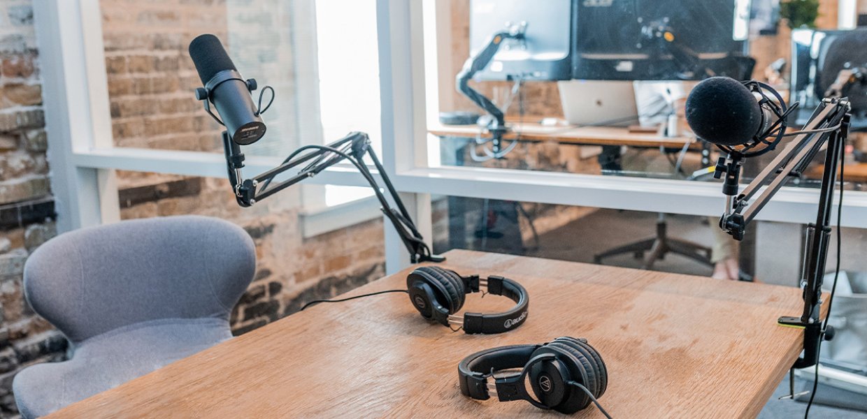 A recording room with microphones and headsets.