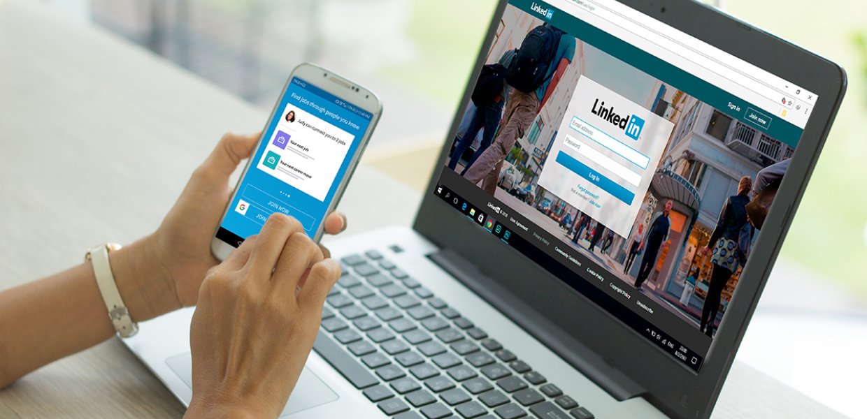 Photo of a person using LinkedIn on a computer and on a mobile phone app