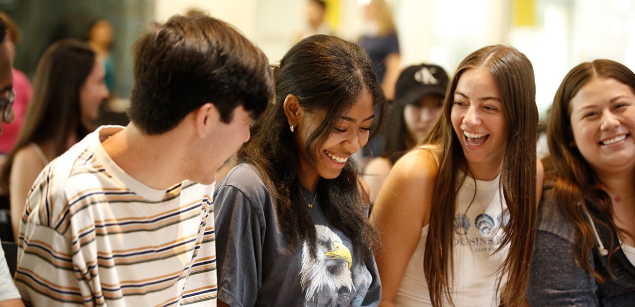 New Annenberg students socialize before the new student assembly in the ANN Forum, 2024.